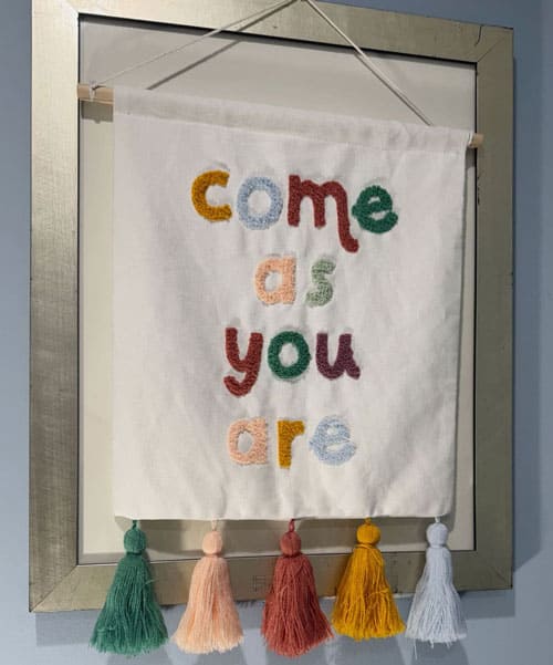 Come as you are banner on a frame