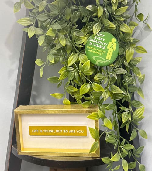 Life is tough but so are you quote in a frame on shelf